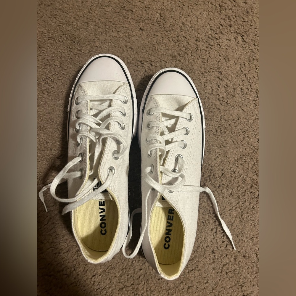 Women’s white low top platform Converse.